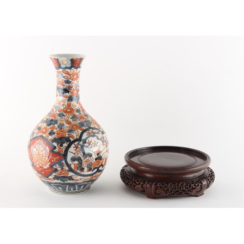 220 - Property of a gentleman - a 19th century Japanese Imari bottle vase, 9.1ins. (23.1cms.) high; togeth... 