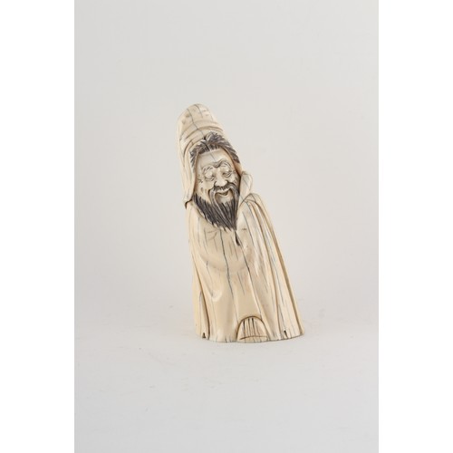 152 - Property of a gentleman - a Chinese carved walrus ivory figure of a sage, early 20th century, incise... 