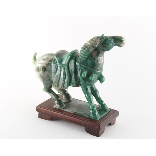 150 - Property of a gentleman - a Chinese Tang style carved nephrite jade model of a caparisoned horse, 20... 