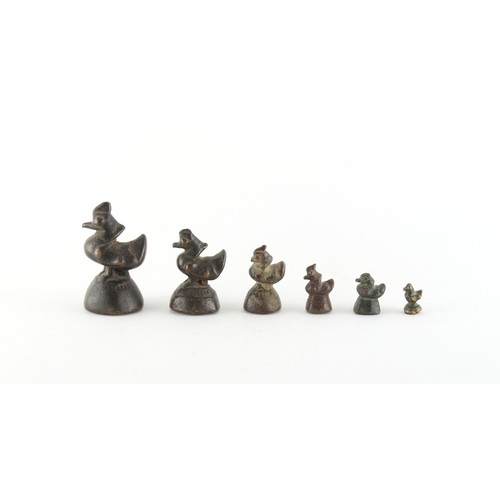 148 - Property of a gentleman - a graduated set of six bronze opium weights modelled as birds, the tallest... 