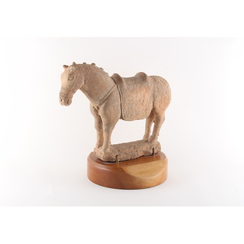 63 - Property of a gentleman - a Chinese Tang style pottery model of a horse, on wooden stand, 13.75ins. ... 