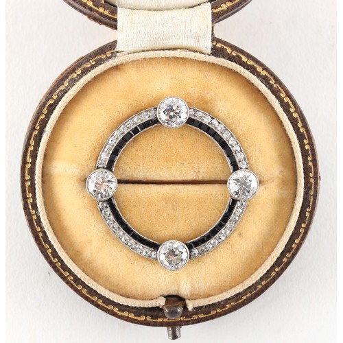 29 - A good early 20th century Art Deco diamond & sapphire hoop brooch, set with four Old European cut di... 