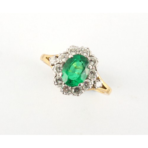 7 - An 18ct yellow gold emerald & diamond oval cluster ring, the vibrant & clear oval cushion cut emeral... 