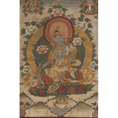 126 - A 19th century thankga painted on linen and depicting the Green Tara, the painting 21.25 by 16.15ins... 