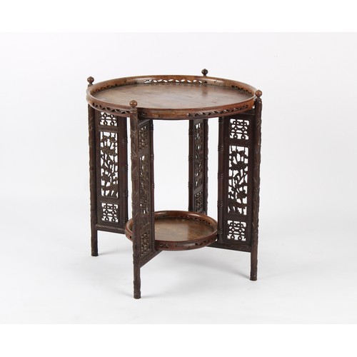 167 - Property of a deceased estate - a Chinese carved hongmu circular two-tier folding table, late 19th /... 