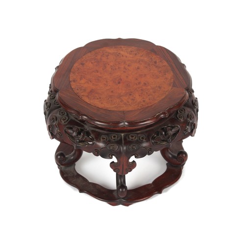 161 - A Chinese hongmu & burr wood stand, well carved with lingzhi, 11.8ins. (30cms.) diameter (overall).