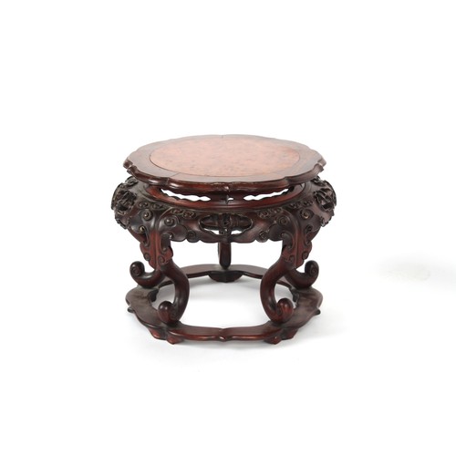 161 - A Chinese hongmu & burr wood stand, well carved with lingzhi, 11.8ins. (30cms.) diameter (overall).