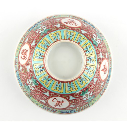 157 - A Chinese famille rose ruby ground medallion bowl, probably Republic period (1912-49), short hairlin... 