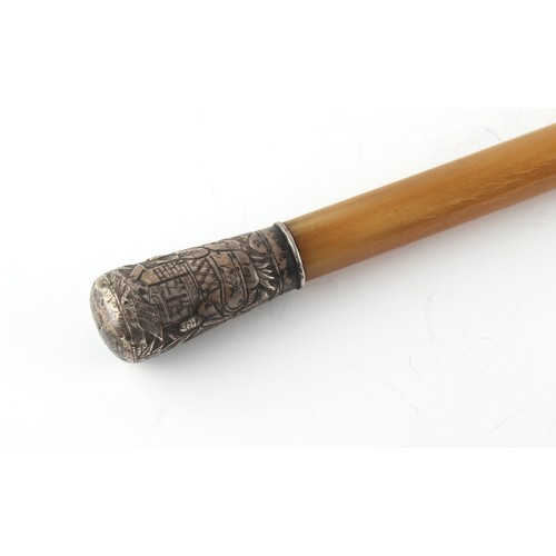 186 - A Chinese silver topped rhino horn short cane, approximately 88 grams, 20.8ins. (52.8cms.) long.