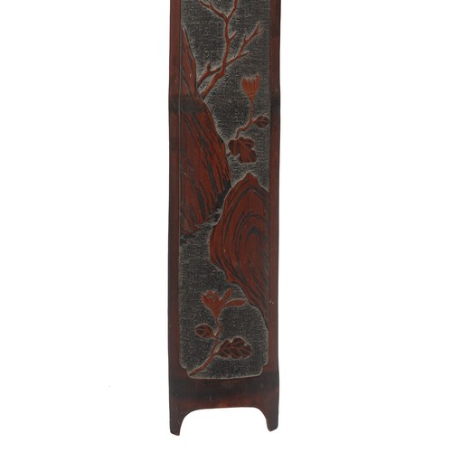 187 - A Chinese carved bamboo long panel, late 19th / early 20th century, depicting a bird in flowering sh... 