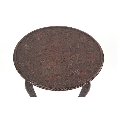 139 - Property of a deceased estate - an Indian carved hardwood circular topped tripod occasional table, 2... 