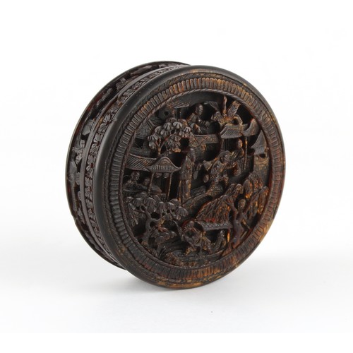 175 - A 19th century Chinese Canton carved tortoiseshell circular box, the cover depicting figures in a la... 