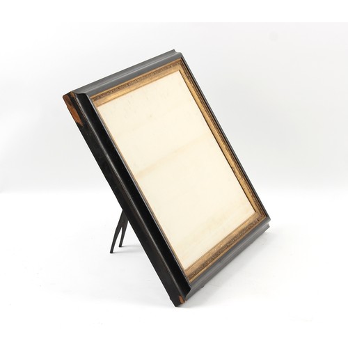 137 - Property of a gentleman - a late 19th century ebonised & parcel gilt easel picture frame, with gilt ... 