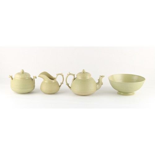 17 - Property of a lady - a Hackwood olive green stoneware four piece tea set with finely moulded cane ba... 