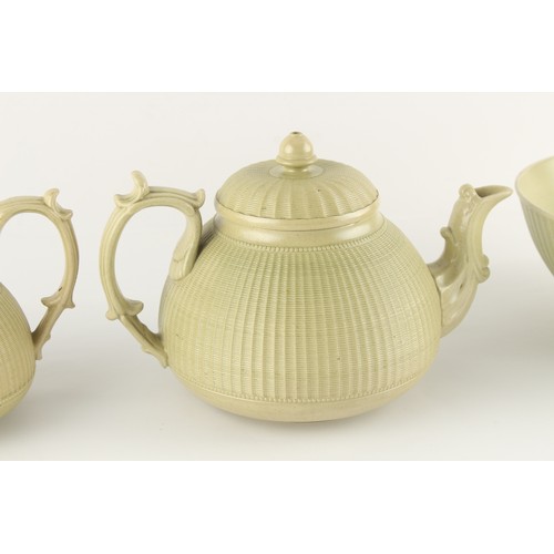 17 - Property of a lady - a Hackwood olive green stoneware four piece tea set with finely moulded cane ba... 