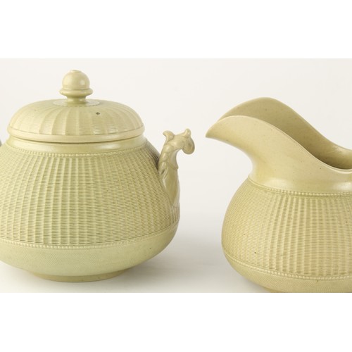 17 - Property of a lady - a Hackwood olive green stoneware four piece tea set with finely moulded cane ba... 