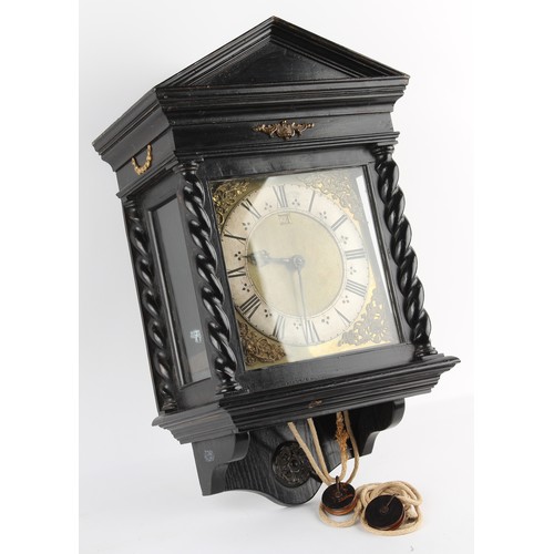 300 - The Henry & Tricia Byrom Collection - an ebonised cased 30-hour wall clock, with 10-inch square bras... 