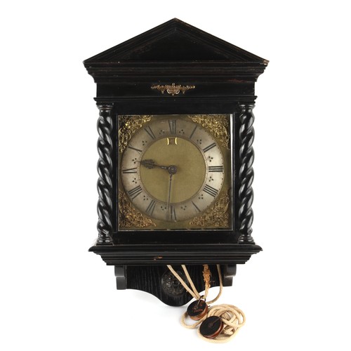 300 - The Henry & Tricia Byrom Collection - an ebonised cased 30-hour wall clock, with 10-inch square bras... 