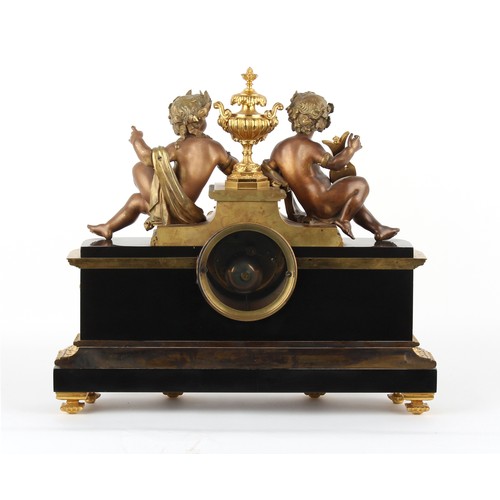 237 - Property of a gentleman - a late 19th century French bronze gilt brass & black marble cased mantel c... 