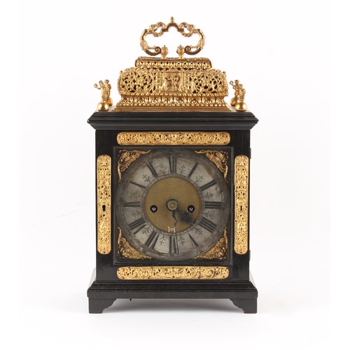 298 - The Henry & Tricia Byrom Collection - a gilt metal mounted ebonised table clock with basket top, cir... 