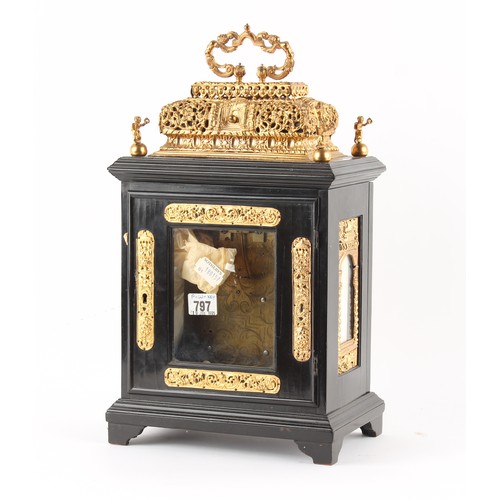 298 - The Henry & Tricia Byrom Collection - a gilt metal mounted ebonised table clock with basket top, cir... 