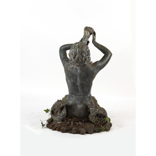 541 - Property of a gentleman - a weathered bronze fountain head modelled as a triton, 37.5ins. (95cms.) h... 