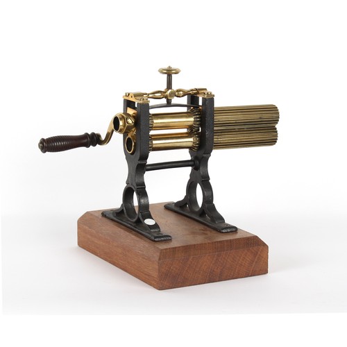 200 - The Henry & Tricia Byrom Collection - a Victorian brass & cast iron crimping machine, 11ins. (28cms.... 