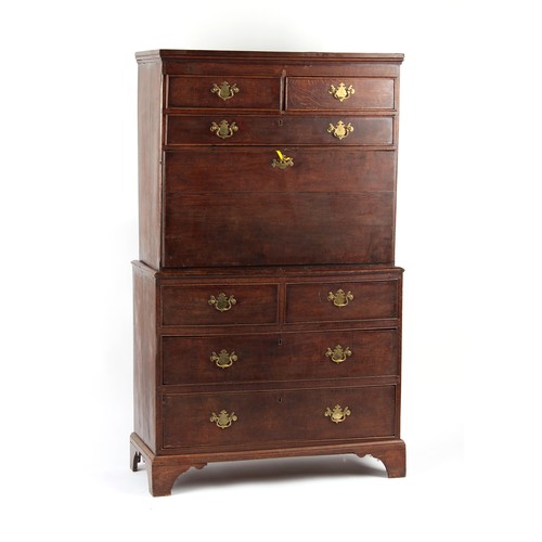 518 - Property of a gentleman - a George III oak two-part secretaire chest, the fall enclosing fitted inte... 