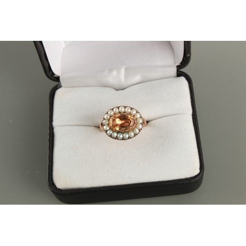 41 - An unmarked 19th century gold topaz & seed pearl ring, the oval cut topaz weighing approximately 1.2... 