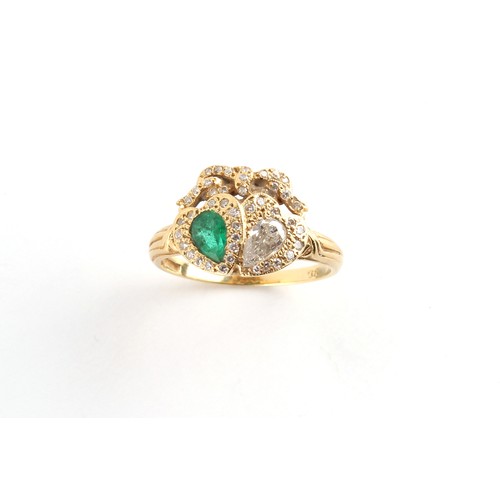 38 - Property of a deceased estate - an 18ct yellow gold emerald & diamond twin heart ring, with a cut pe... 