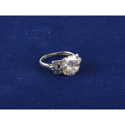 95 - Property of a lady - a platinum diamond single stone ring, the round brilliant cut diamond weighing ... 