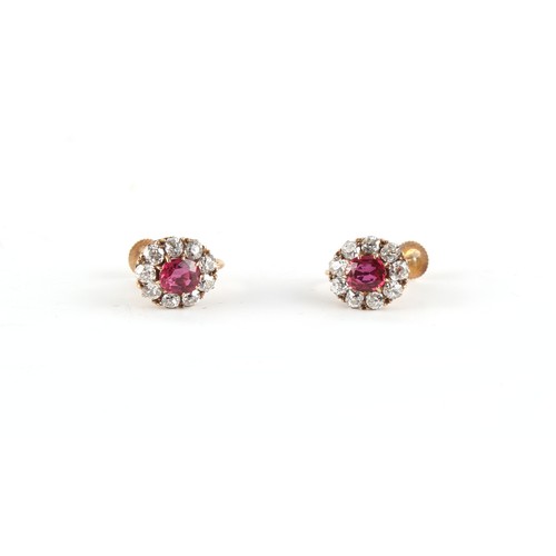 84 - Property of a lady - a pair of ruby & diamond oval cluster earrings, with screw fastenings, the oval... 