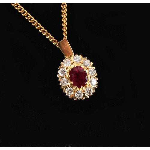 83 - Property of a lady - an unmarked yellow gold (tests high carat) ruby & diamond pendant, the oval cus... 