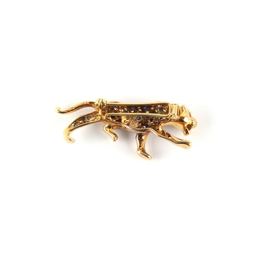 23 - An 18ct yellow gold ruby sapphire & diamond brooch modelled as a prowling tiger or panther, 38mm lon... 