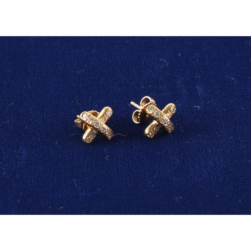 39 - Tiffany & Co. - a pair of 18ct yellow gold diamond earrings, of cross form, with post & butterfly fa... 