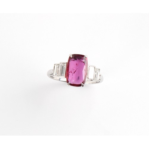 125 - An Art Deco style ruby & diamond ring, the rounded rectangular cushion cut ruby weighing approximate... 