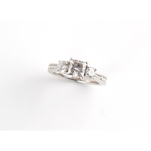 110 - A good 18ct white gold diamond three stone ring, the centre certificated princess cut diamond weighi... 