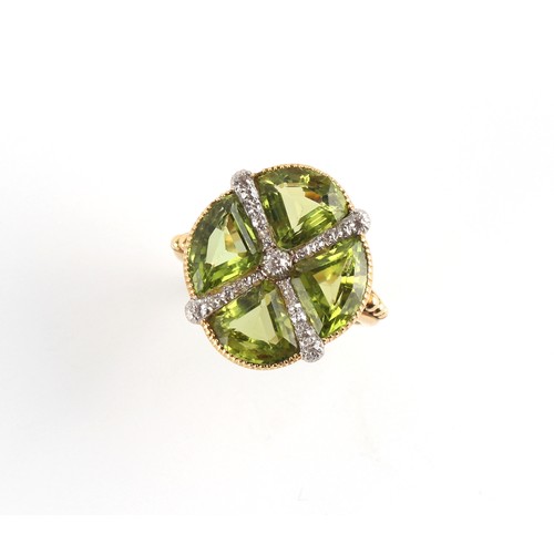 73 - An unusual Continental unmarked 18ct yellow gold peridot & diamond ring, the quatrefoil setting with... 