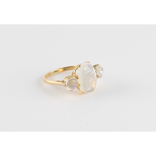 61 - An unmarked high carat yellow gold moonstone three stone ring, the largest moonstone measuring appro... 