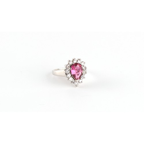 132 - A pink tourmaline & diamond pear shaped cluster ring, the pear shaped tourmaline weighing approximat... 