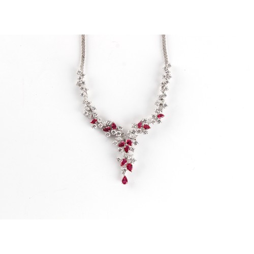 140 - A fine certificated unheated ruby & diamond necklace, the twelve pear shaped cut Mogok Burmese rubie... 