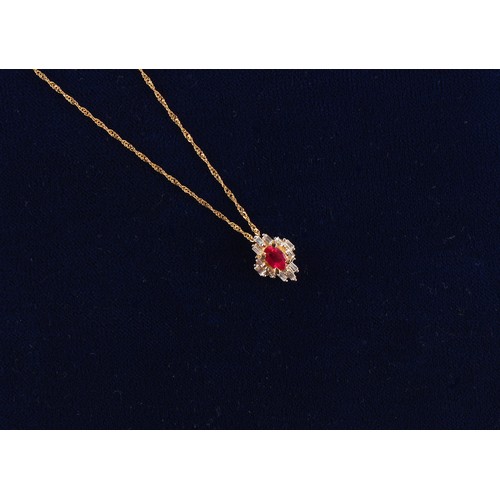 21 - En suite with the preceding lot - a 14ct yellow gold ruby & diamond pendant on chain necklace, the c... 