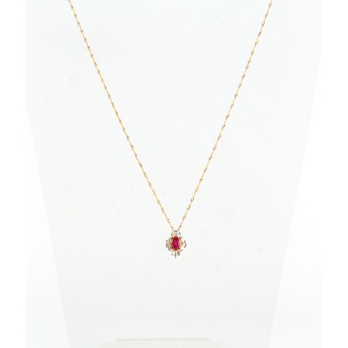 21 - En suite with the preceding lot - a 14ct yellow gold ruby & diamond pendant on chain necklace, the c... 