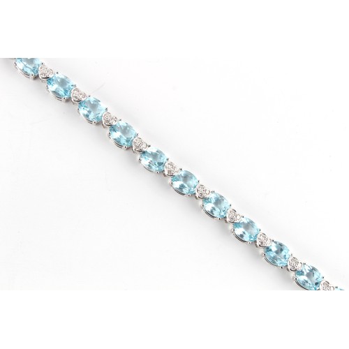 76 - A good 18ct white gold pale blue topaz & diamond riviere necklace, possibly Asprey, with twenty-nine... 