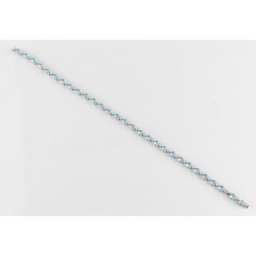 76 - A good 18ct white gold pale blue topaz & diamond riviere necklace, possibly Asprey, with twenty-nine... 