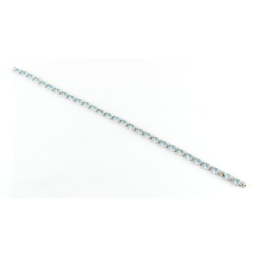 76 - A good 18ct white gold pale blue topaz & diamond riviere necklace, possibly Asprey, with twenty-nine... 