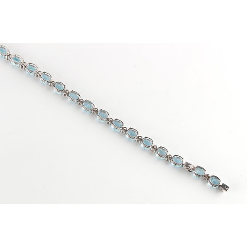 76 - A good 18ct white gold pale blue topaz & diamond riviere necklace, possibly Asprey, with twenty-nine... 