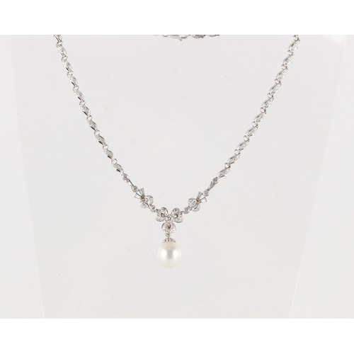 139 - An 18ct white gold large single pearl & diamond necklace, the pearl measuring approximately 11 by 11... 