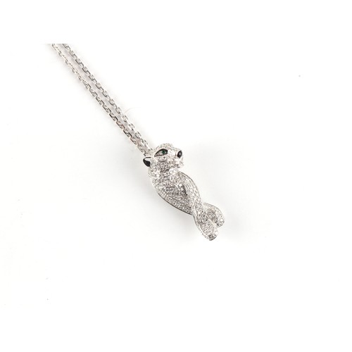 141 - Cartier - an 18ct white gold diamond emerald & sapphire leopard pendant on 18ct white gold chain nec... 