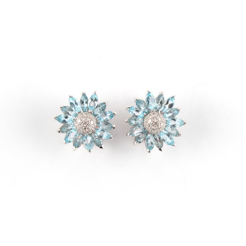 75 - A good pair of 18ct white gold pale blue topaz & diamond flowerhead earrings, possibly Asprey, with ... 